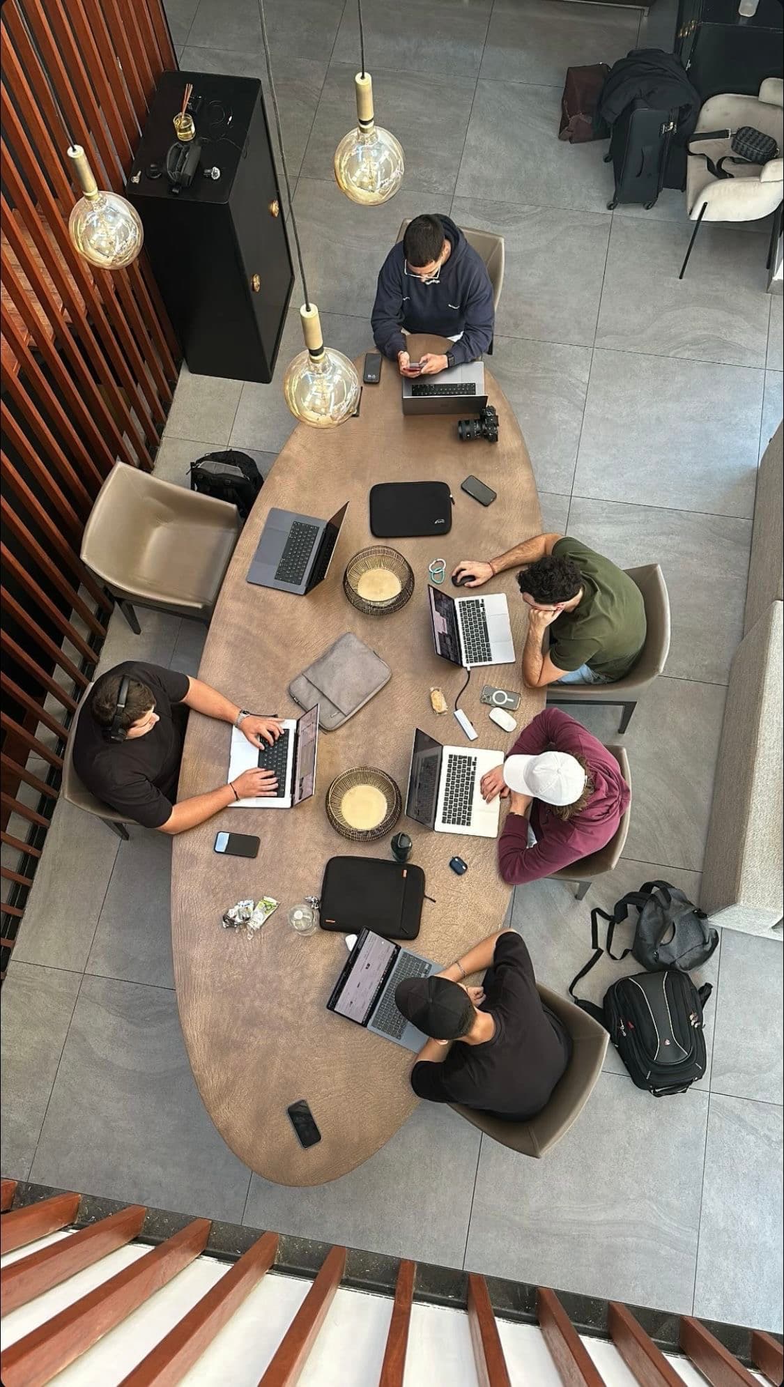 The Méllon team gathered around a table
